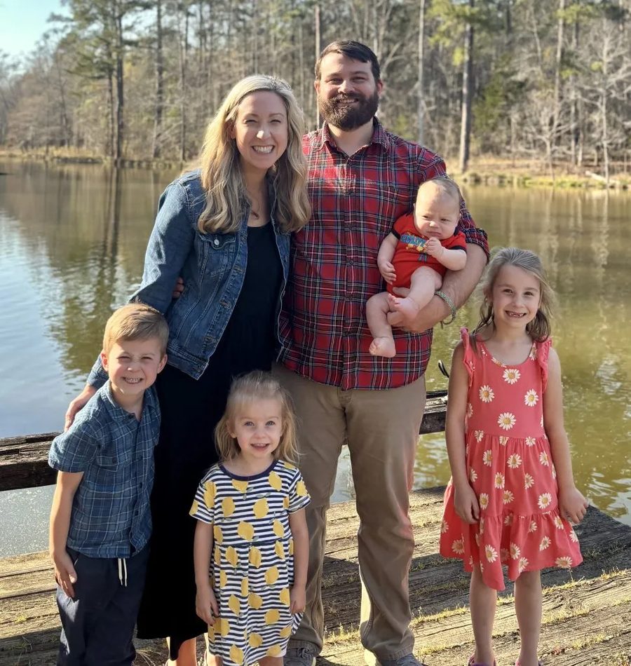 Nathan, founder of Emerald Titan Consulting, with his family outdoors in Greensboro, Georgia